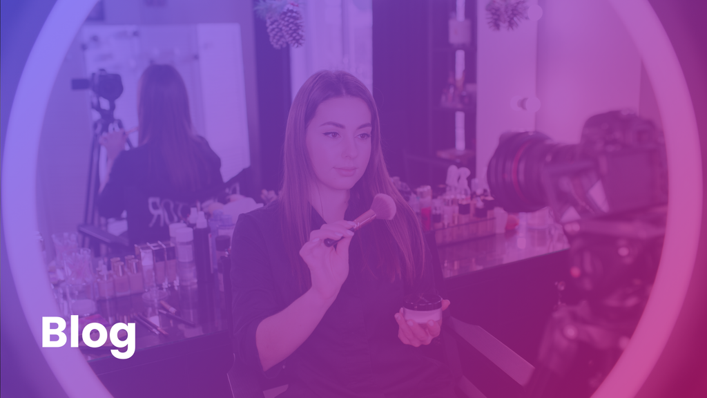 A woman filming a makeup tutorial for a blog